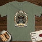 What Would Dog Do Cavalier T-Shirt flat lay in Sage, featuring a rose-bordered gold portrait medallion of a haloed Cavalier King Charles Spaniel with the question What Would Dog Do.